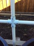 Cross joiner with pop rivets