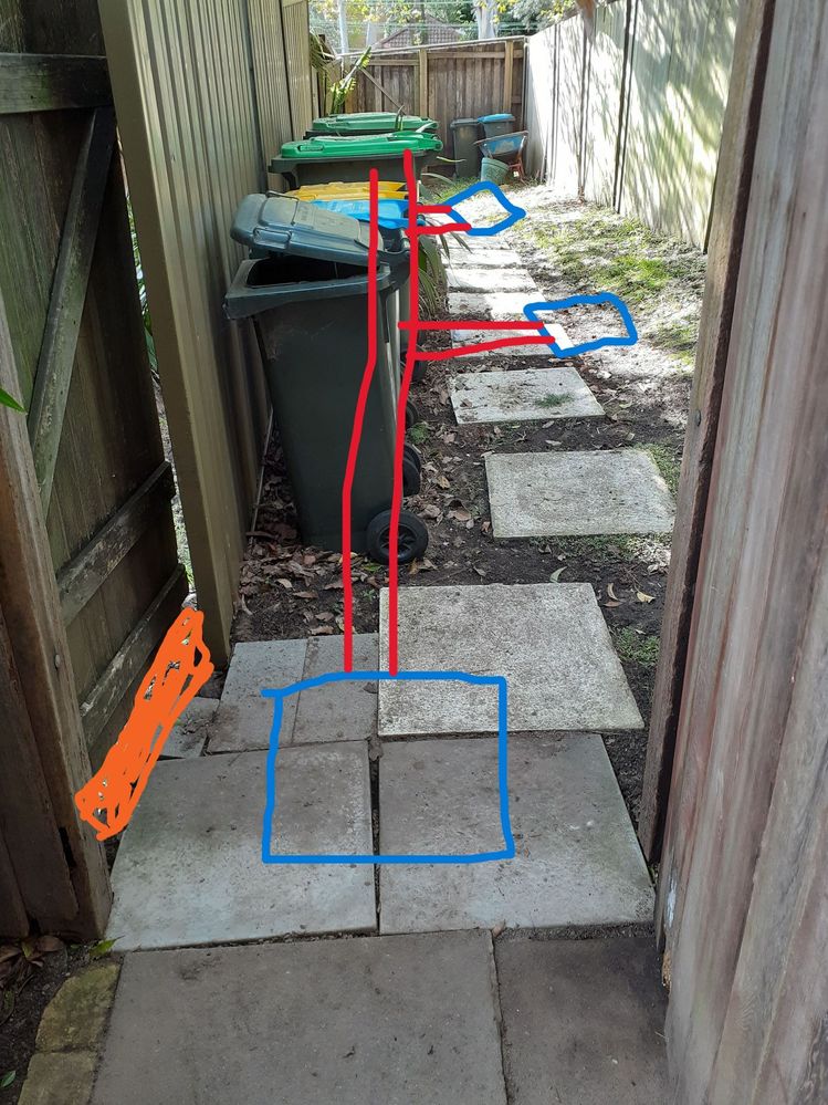 Raised step (orange) for timber gate to contain runoff to lane showing large stormwater pit and 2 other pits downstream connected by discharge pipe
