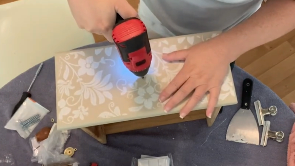 Making the holes a bit bigger so the bolt fits through.