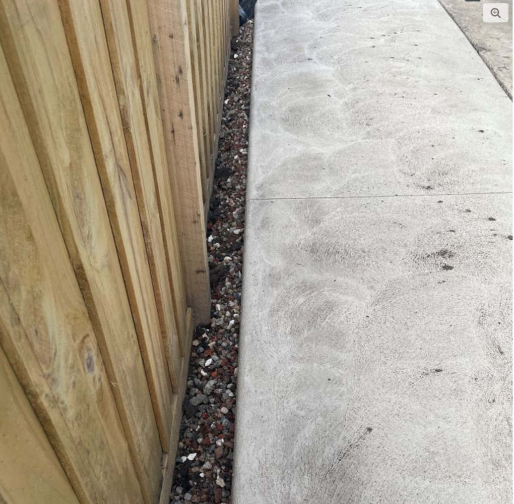 Suggest we lay pebbles between fence and slab