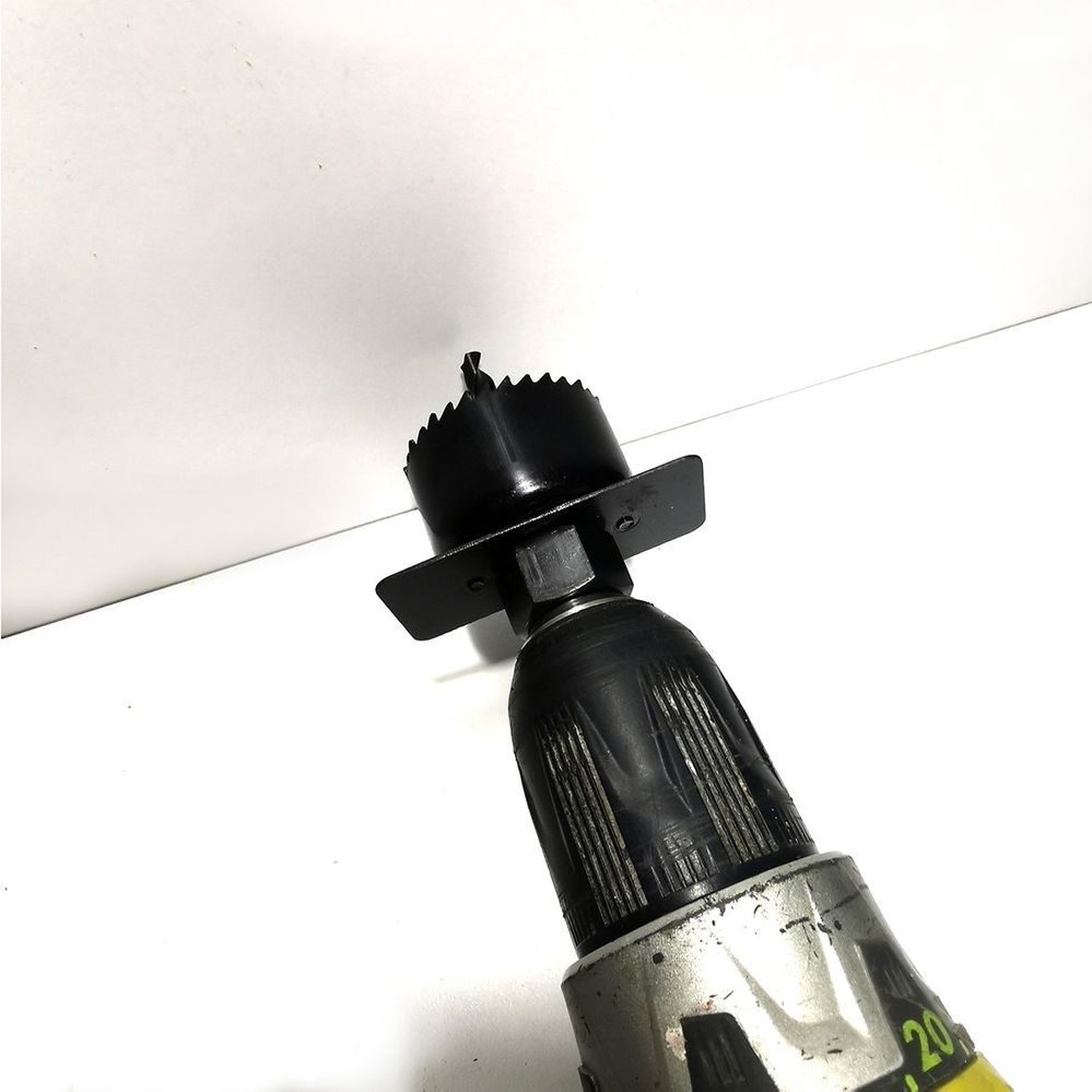 1.2 Drilling holes in cabinet panel.jpg