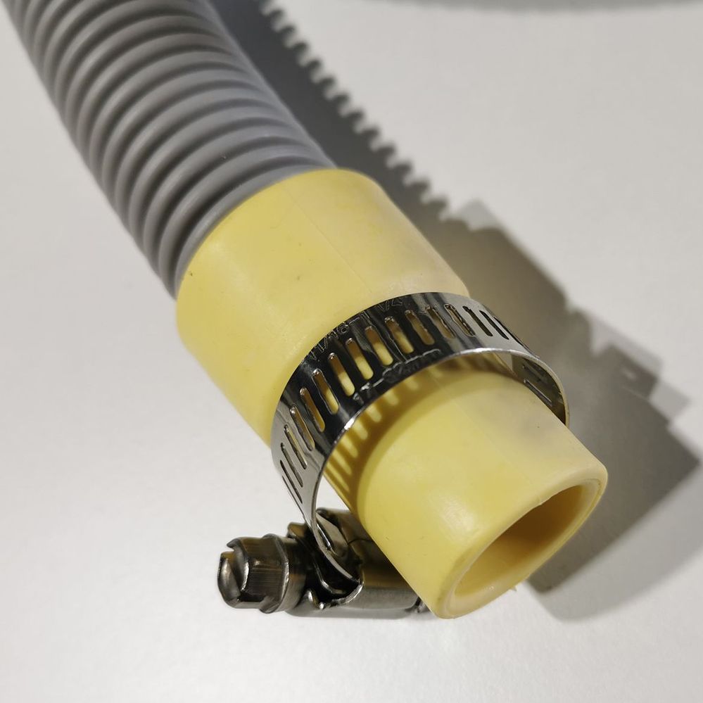 5.1 Placing strap clamp on waste hose.jpg