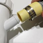 5.2 Pushing waste hose onto spigot.jpg