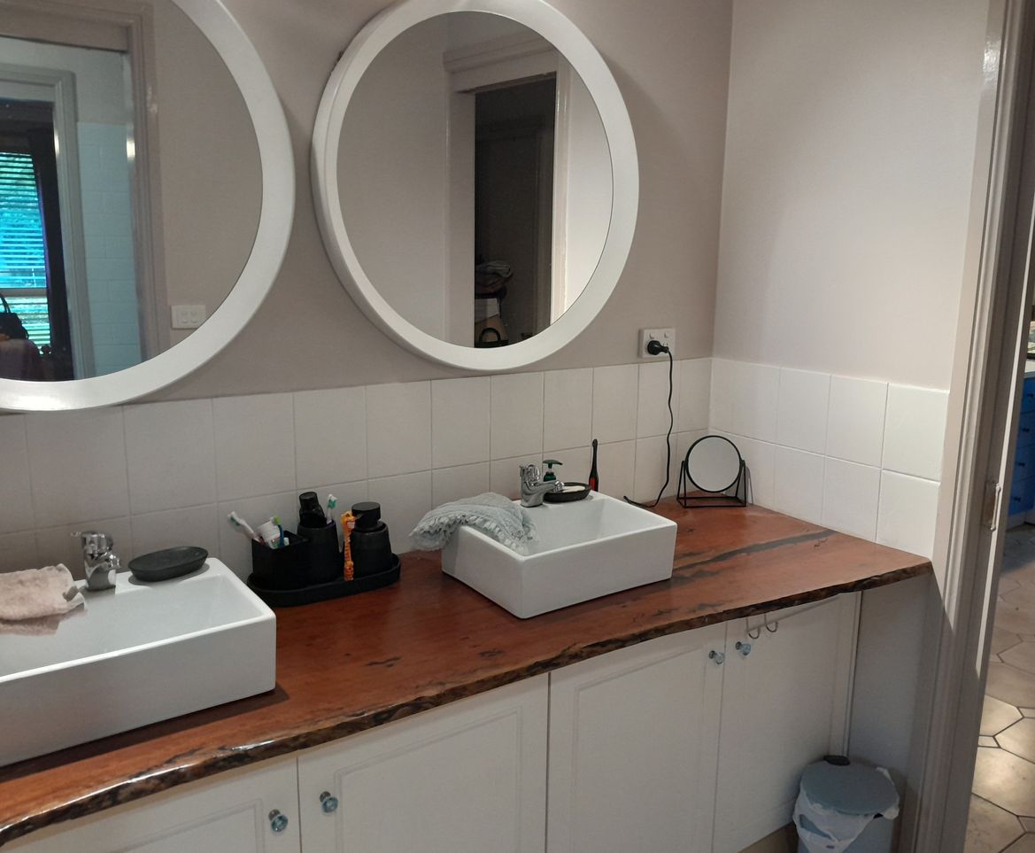 Remove lg mirror, replaced with two round ones and spot lights above each