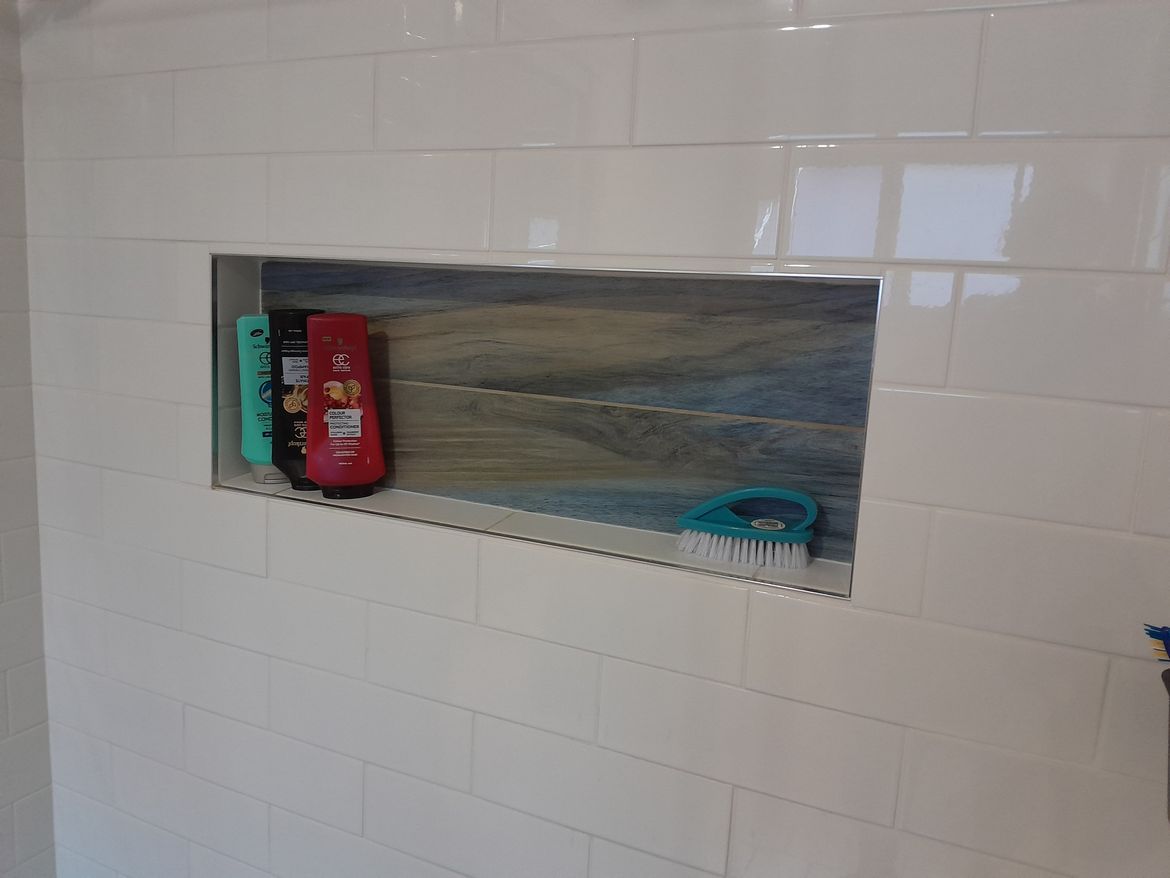 Had an amazing fellow add a niche and re-tile after a total revamp