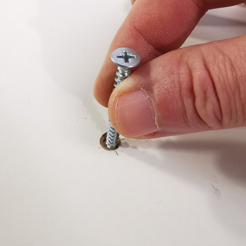 4.1 Placing screw in hole.png