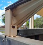 Bracket attaching to fence